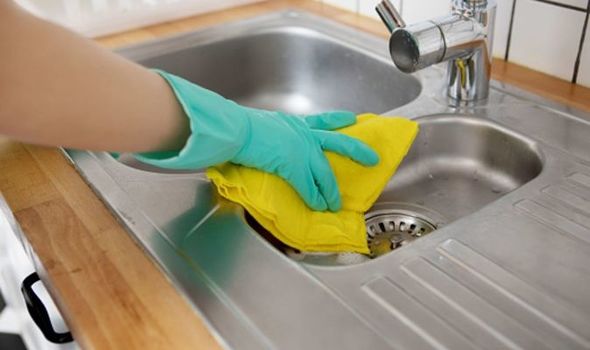 cleaning kitchen sink and drain