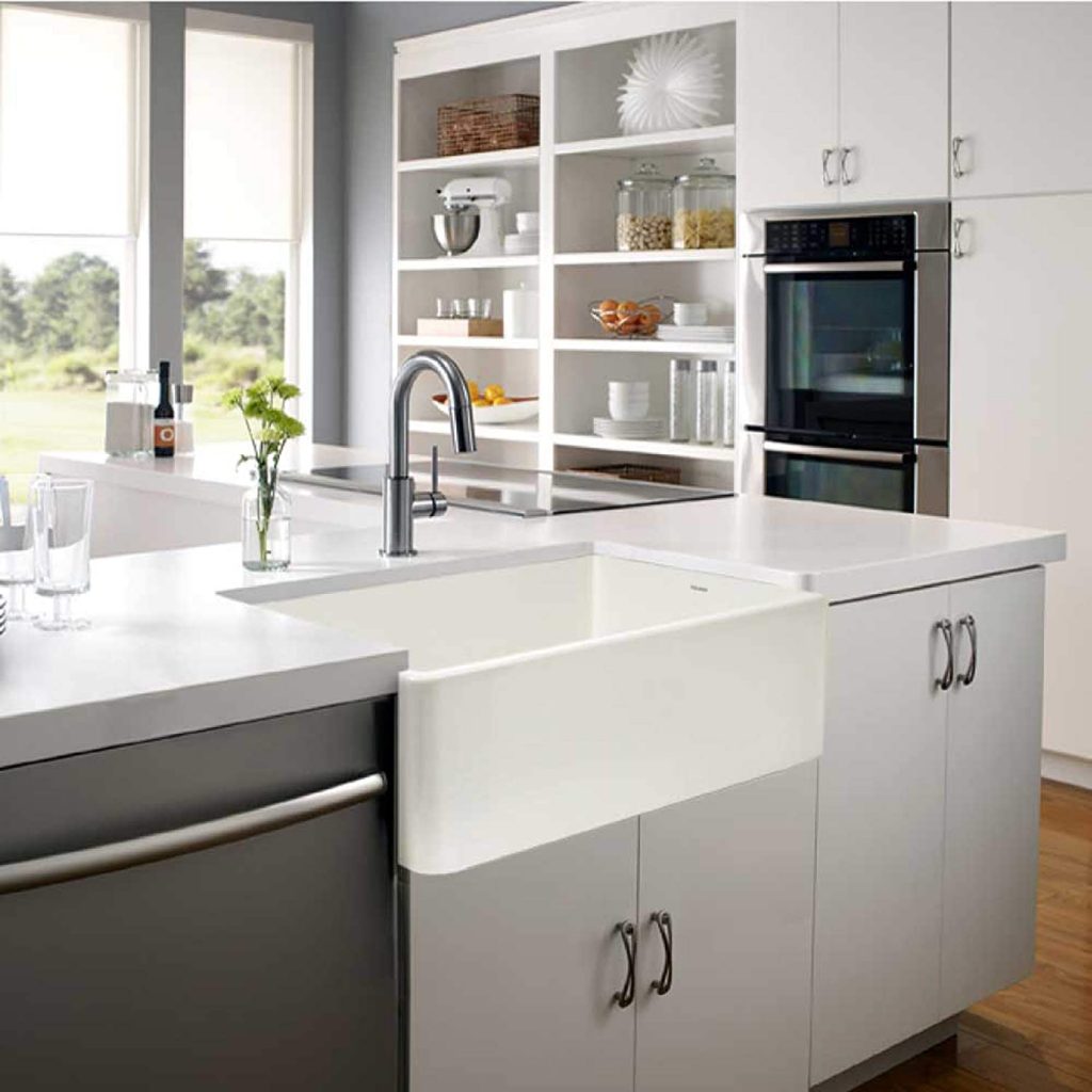 white ceramic apron style undermount kitchen sink